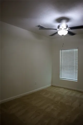 a kitchen with a sink a counter top space stainless steel appliances and cabinets