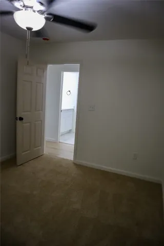 a kitchen with a sink and a refrigerator