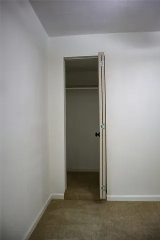 a view of kitchen with wooden floor and electronic appliances