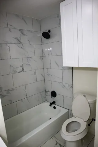 a bathroom with a toilet and a sink