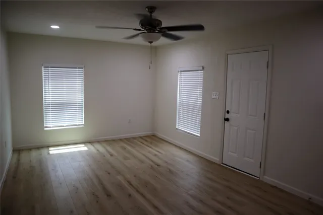 a kitchen with granite countertop a sink and steel appliances