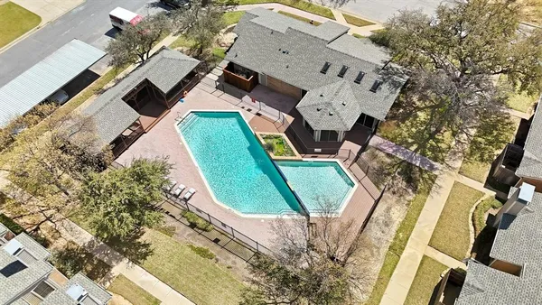 an aerial view of a house with swimming pool