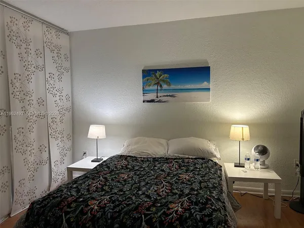 a bathroom with a sink mirror and toilet