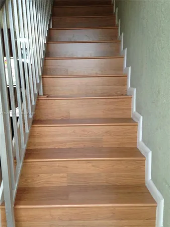 swimming pool view with a garden space