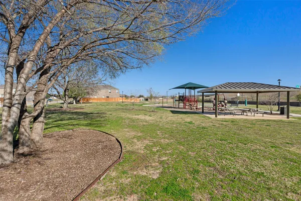 a view of a swimming pool with a yard
