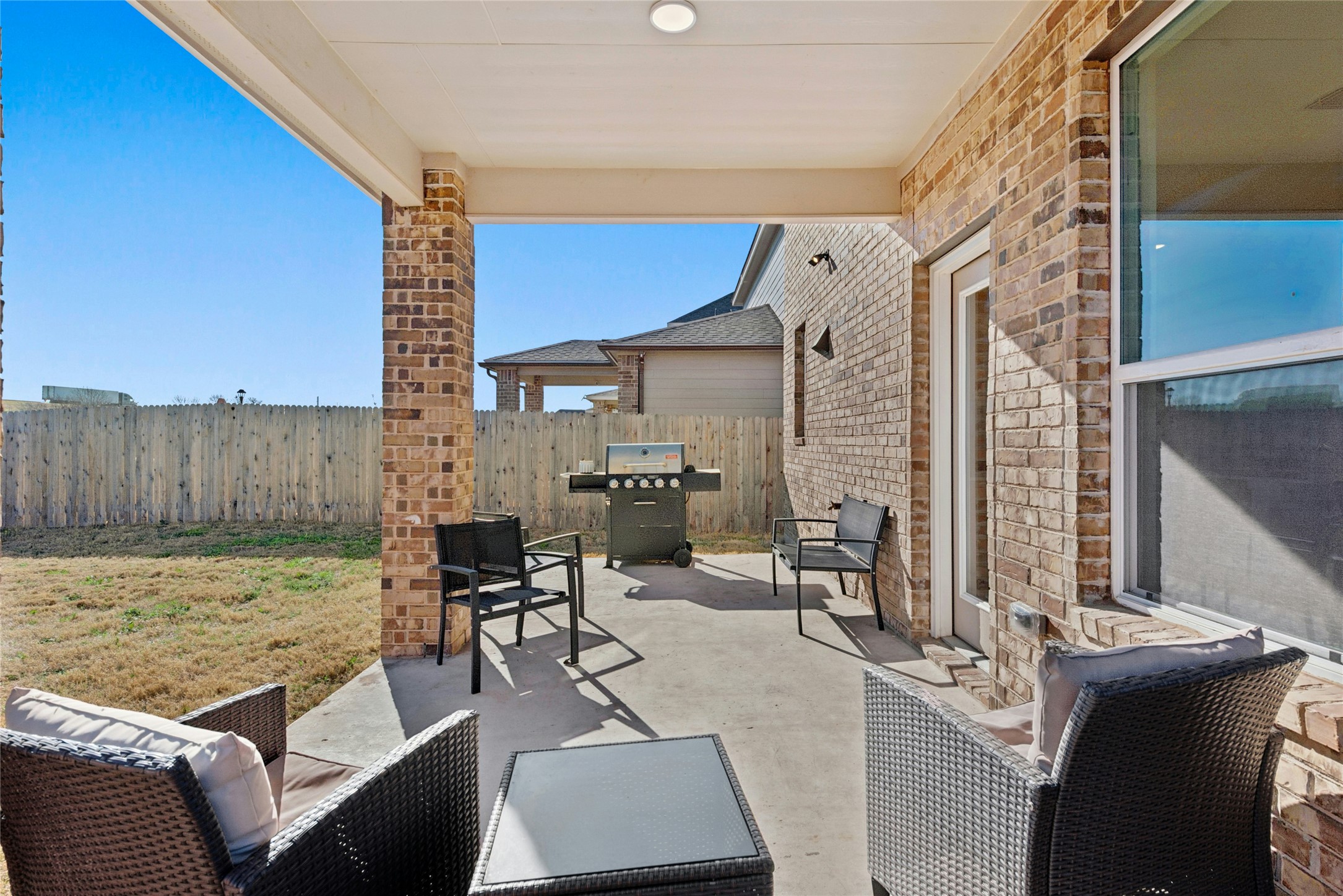 2001 Saskatoon Street Georgetown, TX 78626 - Photo 6 of 40 Fenced backyard featuring a grill, extended covered patio area ideal for gatherings and endless hours of entertainment