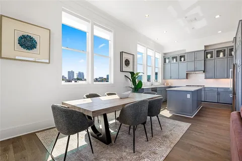 a kitchen with a table and chairs in it
