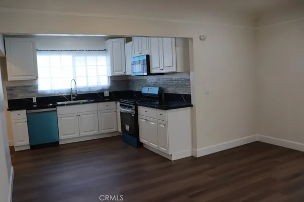 a bathroom with a sink and a window