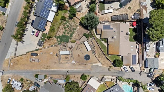 a dining room with furniture a chandelier and wooden floor