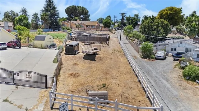 a room with stainless steel appliances kitchen island granite countertop a stove and a sink