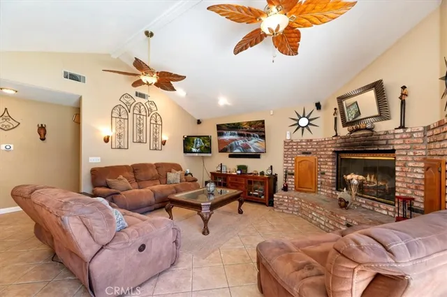 a living room with a bed furniture and a window