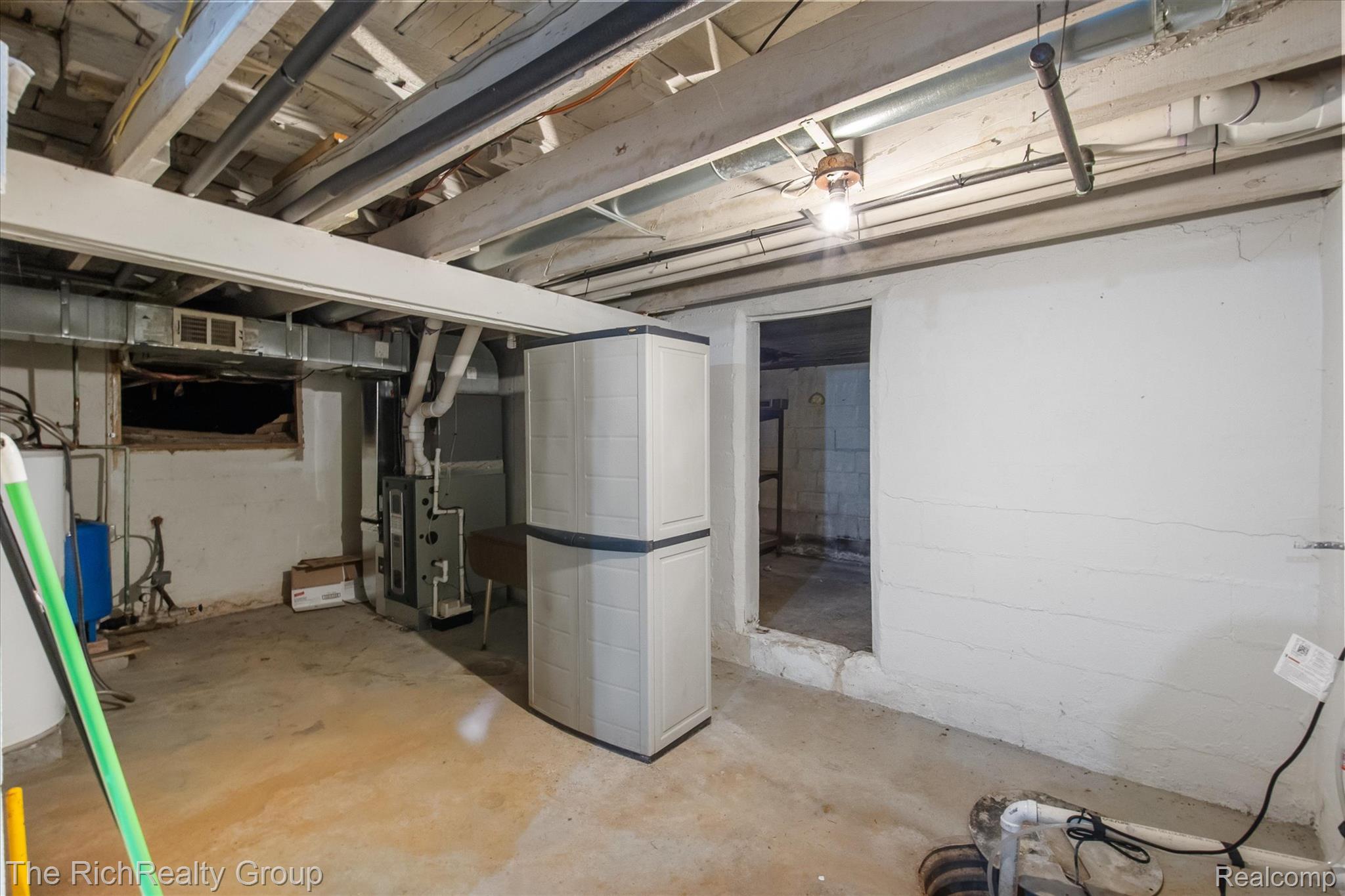 39635 Lotzford Road Canton, MI 48187 - Photo 27 of 39 Unfinished basement with water heater, heating unit, and a water pressure tank