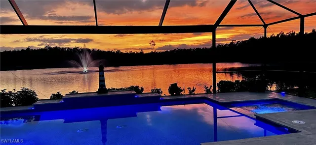 a view of swimming pool with outdoor seating