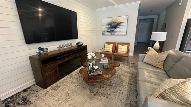 a living room with furniture and a flat screen tv