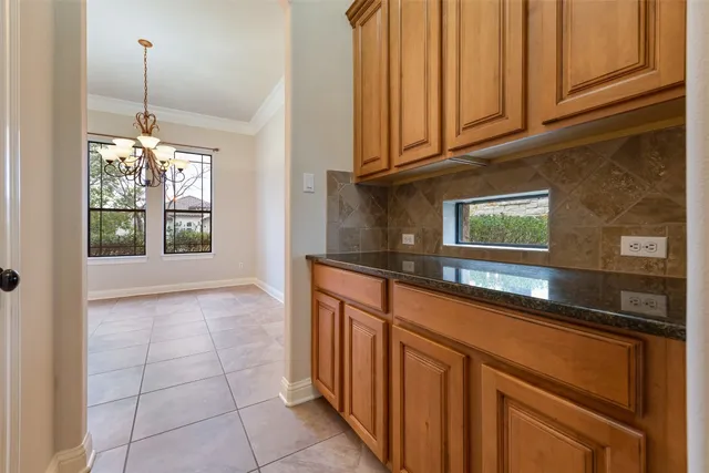 a kitchen with stainless steel appliances granite countertop a sink and a granite counter tops