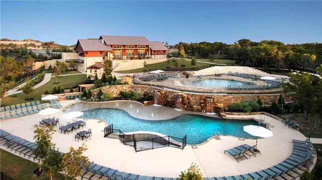 a view of a swimming pool with a garden