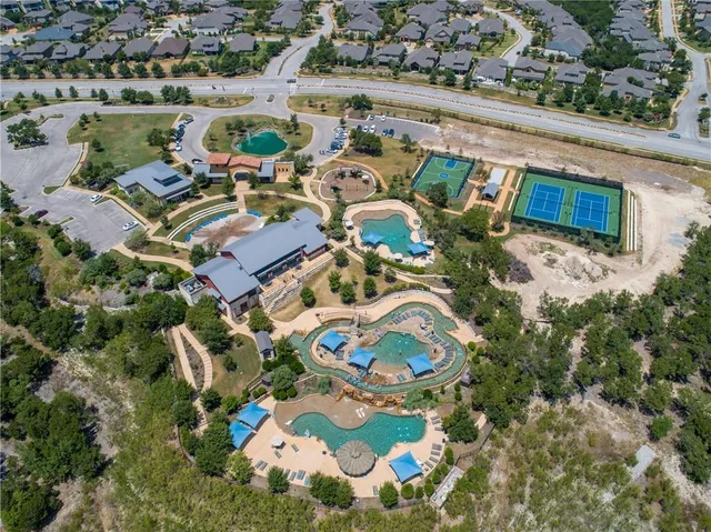 an aerial view of a swimming pool and outdoor space