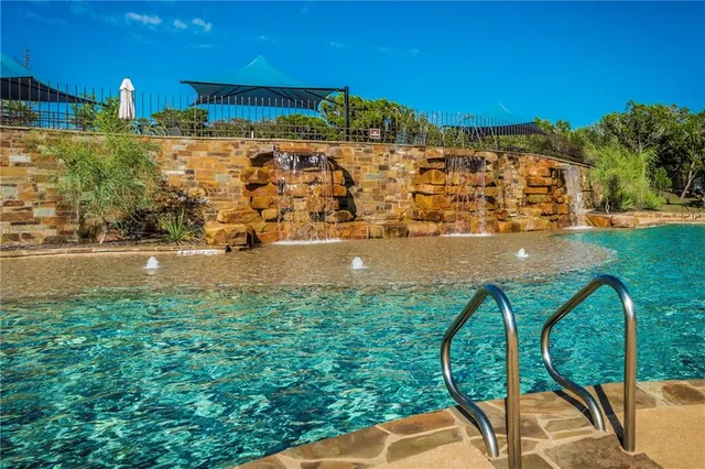 a view of a swimming pool with a patio