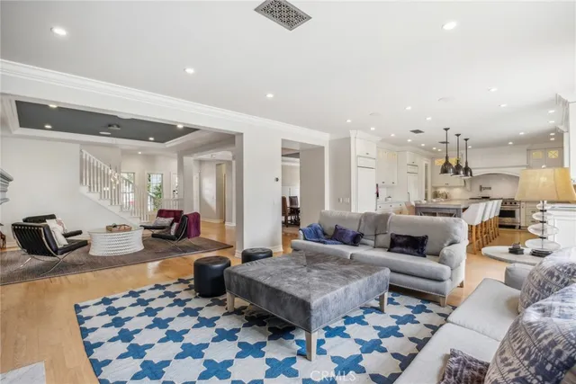 a living room with furniture and a rug