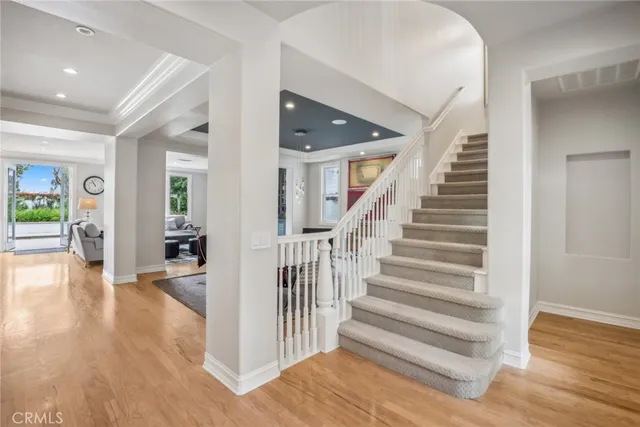 a view of entryway with wooden floor and stairs