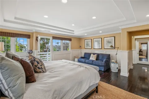 a bedroom with a large bed and a large window