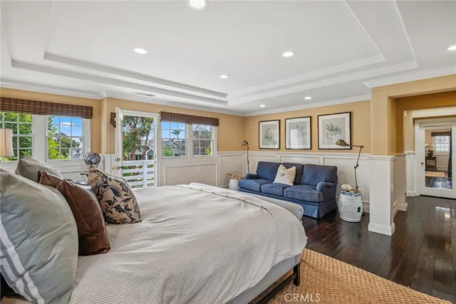 a bedroom with a large bed and a large window