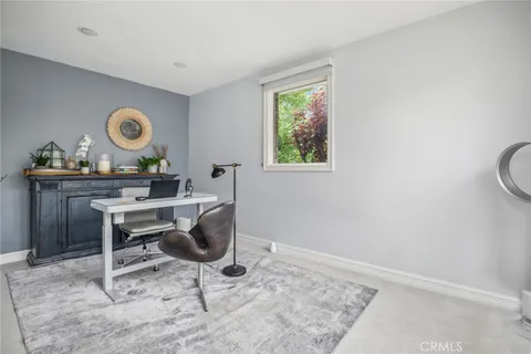 a workspace with furniture and window