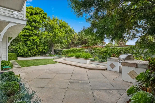 a view of backyard with outdoor seating and green space