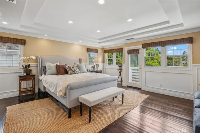 a bedroom with a large bed and a large window