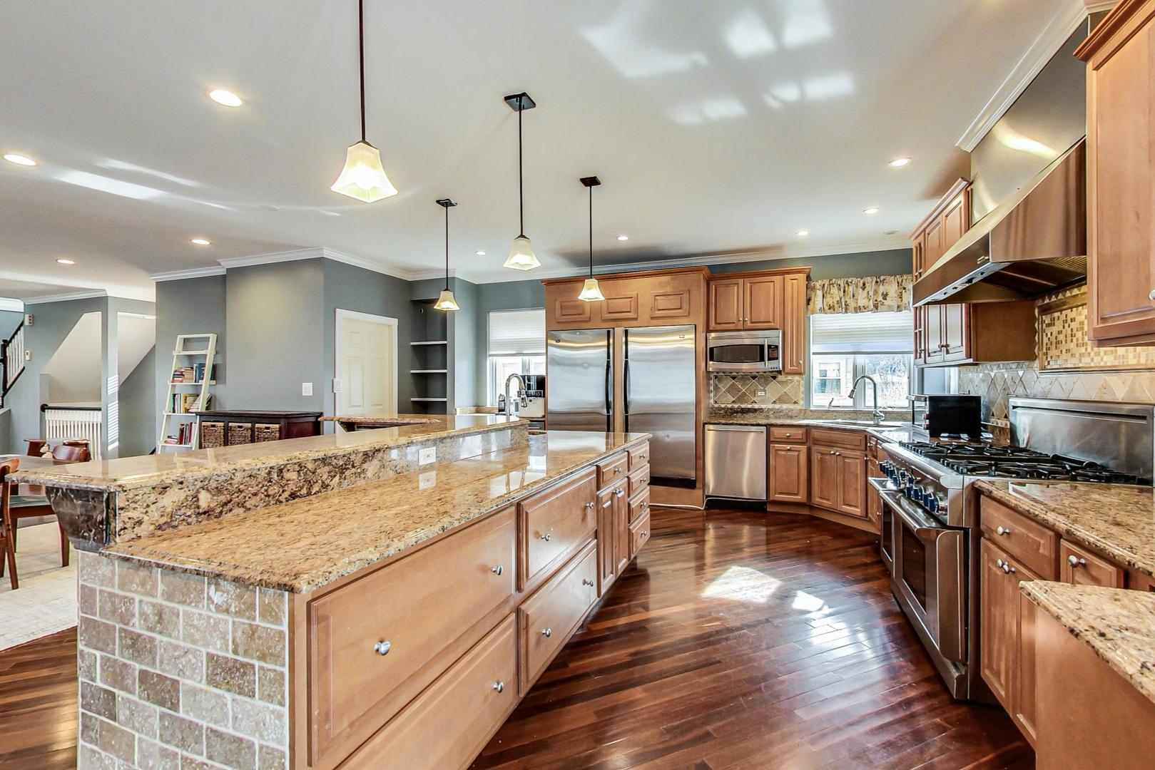 482 Sumac Road Highland Park, IL 60035 - Photo 11 of 29 a large kitchen with stainless steel appliances granite countertop plenty wooden cabinets counter space a sink and a large window