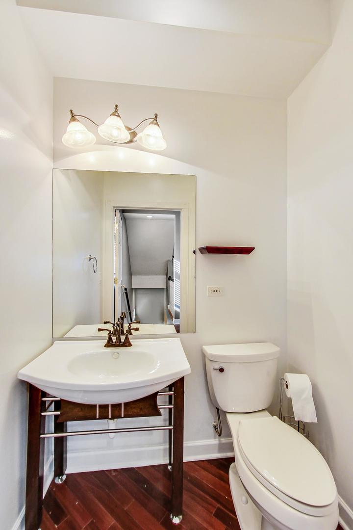482 Sumac Road Highland Park, IL 60035 - Photo 12 of 29 a bathroom with a sink a toilet and mirror