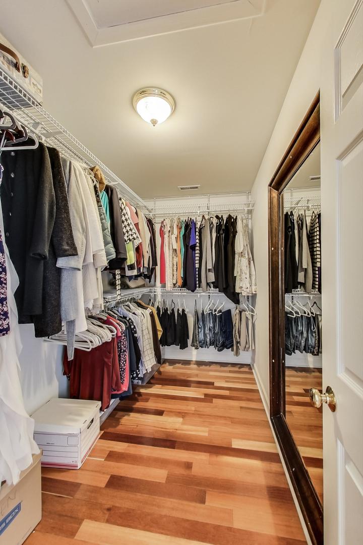 482 Sumac Road Highland Park, IL 60035 - Photo 14 of 29 a view of walk in closet with clothes and shoes
