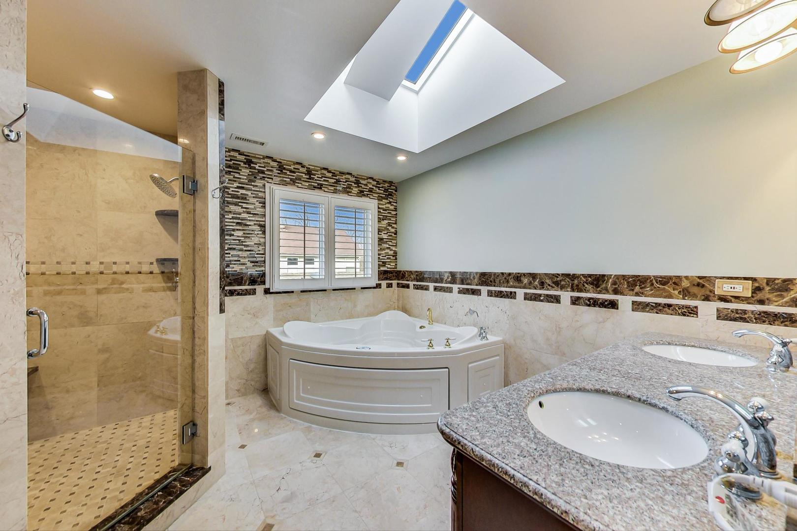 482 Sumac Road Highland Park, IL 60035 - Photo 15 of 29 a bathroom with a granite countertop sink a toilet a mirror and shower