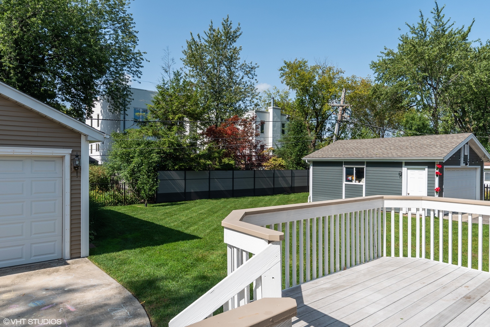 482 Sumac Road Highland Park, IL 60035 - Photo 23 of 29 a view of a house with a small yard and wooden fence