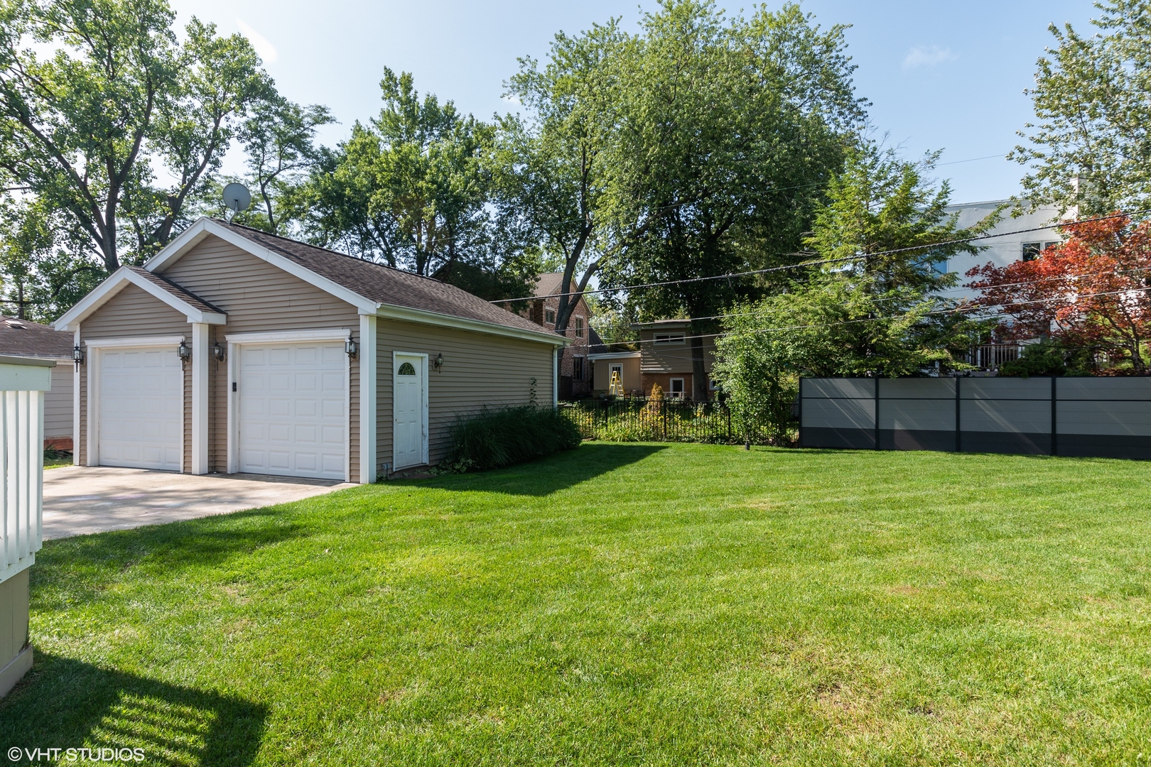 482 Sumac Road Highland Park, IL 60035 - Photo 25 of 29 a front view of a house with a garden and trees