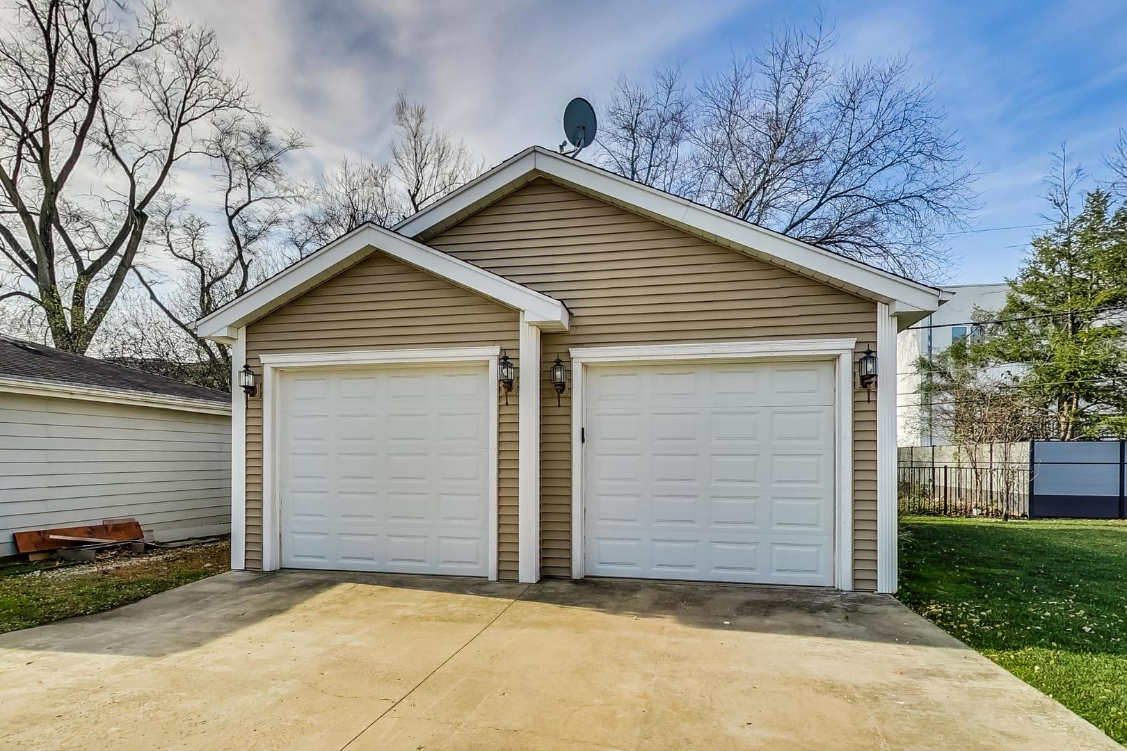 482 Sumac Road Highland Park, IL 60035 - Photo 26 of 29 a view of house with a yard and garage
