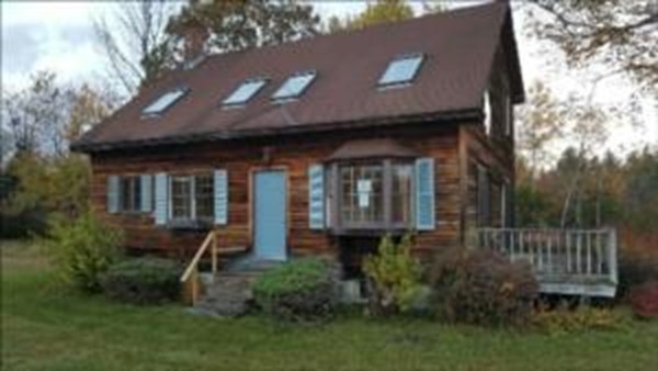 43 Middletown Hill Road Rowe, MA 01367 - Photo 1 of 17 a view of a house with brick walls and a yard with plants
