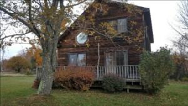 43 Middletown Hill Road Rowe, MA 01367 - Photo 4 of 17 a view of a house with a small yard and a tree