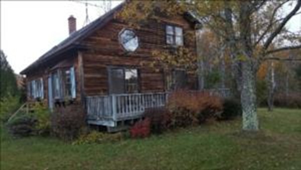 43 Middletown Hill Road Rowe, MA 01367 - Photo 5 of 17 a view of a house with a small yard and floor to ceiling window