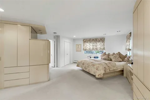 a spacious bathroom with a double vanity sink mirror and double