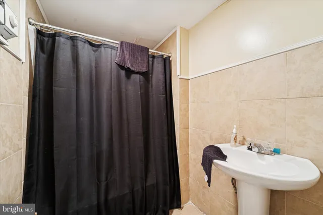 a bathroom with a sink and mirror