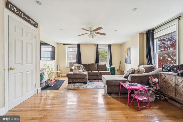 a living room with furniture or couch and a large window
