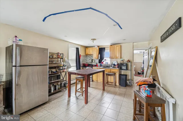 a kitchen with stainless steel appliances a refrigerator and a sink