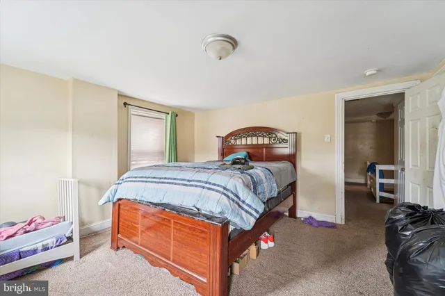 a bedroom with a bed and a closet