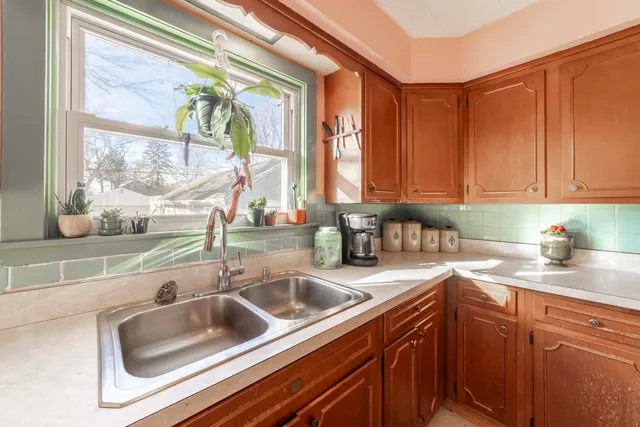a kitchen with a sink and a window
