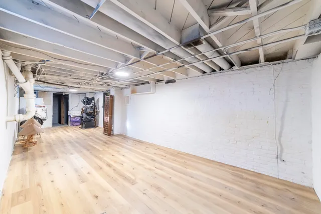 a view of a room with wooden walls