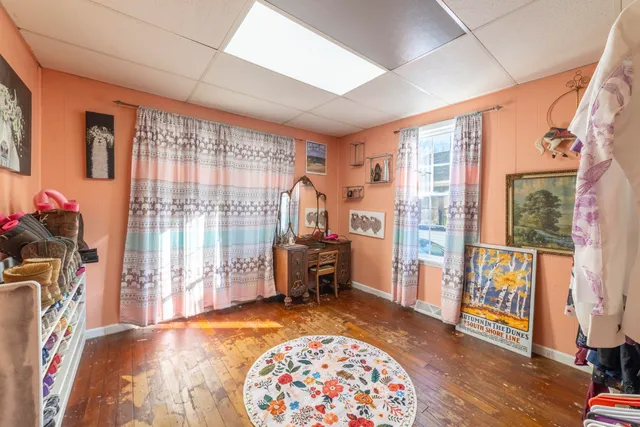 a bedroom with furniture and a window