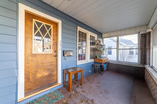 a living room filled with furniture and a window