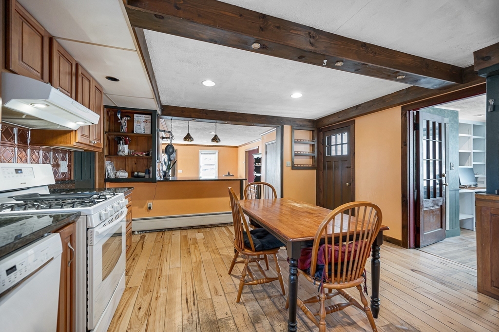 167 North Road Chelmsford, MA 01824 - Photo 13 of 38 a view of a dining room with furniture window and wooden floor