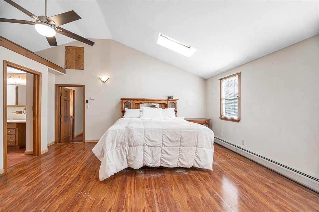 167 North Road Chelmsford, MA 01824 - Photo 20 of 38 a bedroom with a bed and wooden floor